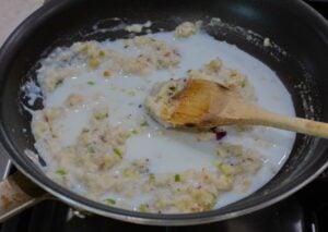 adding milk to the roux