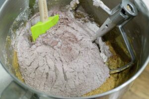 Adding chocolate and flour to the batter