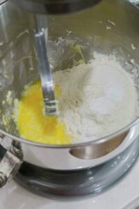 Adding the flour.