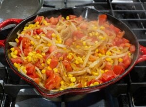 cooked corn, tomato and onion