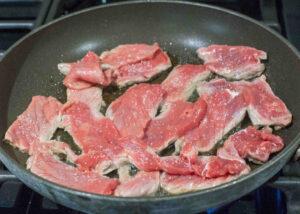steak sliced in pan
