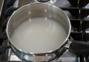 Water and sugar in a small pan