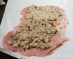 Prune and cream cheese spread on top of the turkey breast