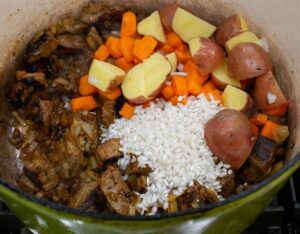 Potatoes and rice on pot