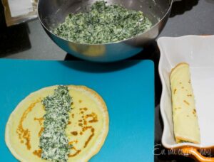 filling the crepes with spinach