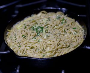 Skillet cooking the spaghetti frittata  