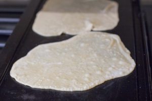 Cooking the tortillas.