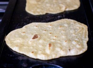 Cooking the tortillas.