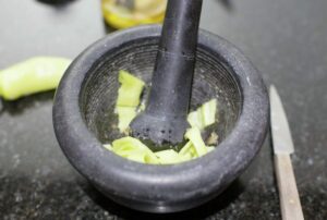 Yellow peppers on a mortar