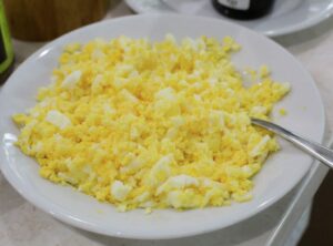Mash hard boiled egg