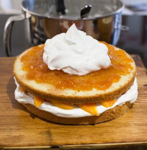 Cream on top of the peach jam