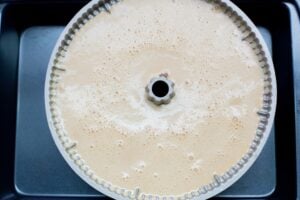 Flan batter layer on the cake pan.