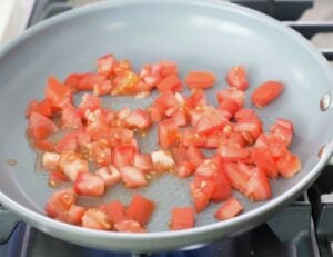 Tomatoes cubed in a pan