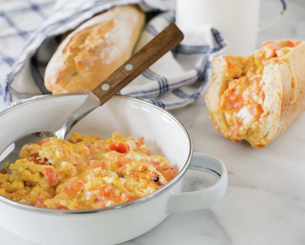 Scrambled eggs with cheese and tomatoes