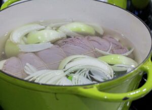 Pot with broth onion and malaya roll