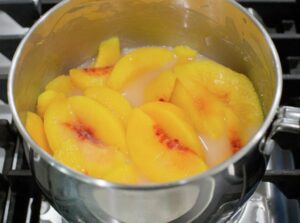 Cooking the peaches.