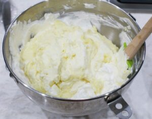 Mixing the pastry cream with the whipped cream.