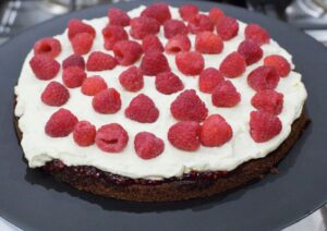 Layer of pastry cream and raspberries.