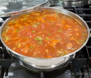 Rice and tomatoes cooking.