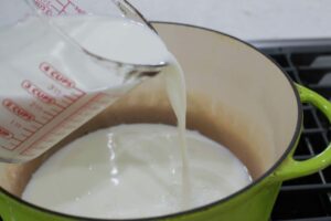 Pouring milk on a pan