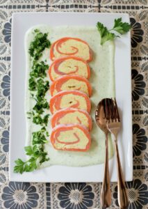 Smoked salmon roulade with cream cheese and avocado cream