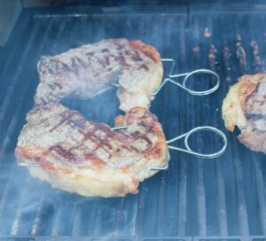 Grilling the steaks.