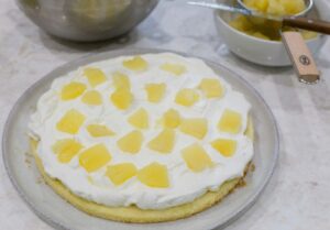 Cream and pineapple on a cake