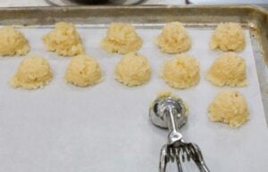 Scooping the coconut balls on a tray