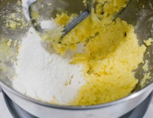 Adding flour to the dough