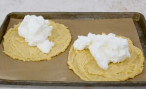 Egg whites beaten on top of the dough.