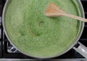 Cilantro sauce on skillet.