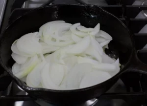 Onions feather like on a cast iron.