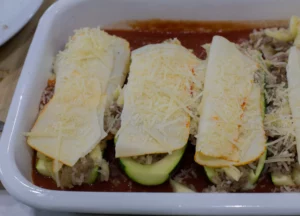 Stuffed zucchini boats before going to the oven.