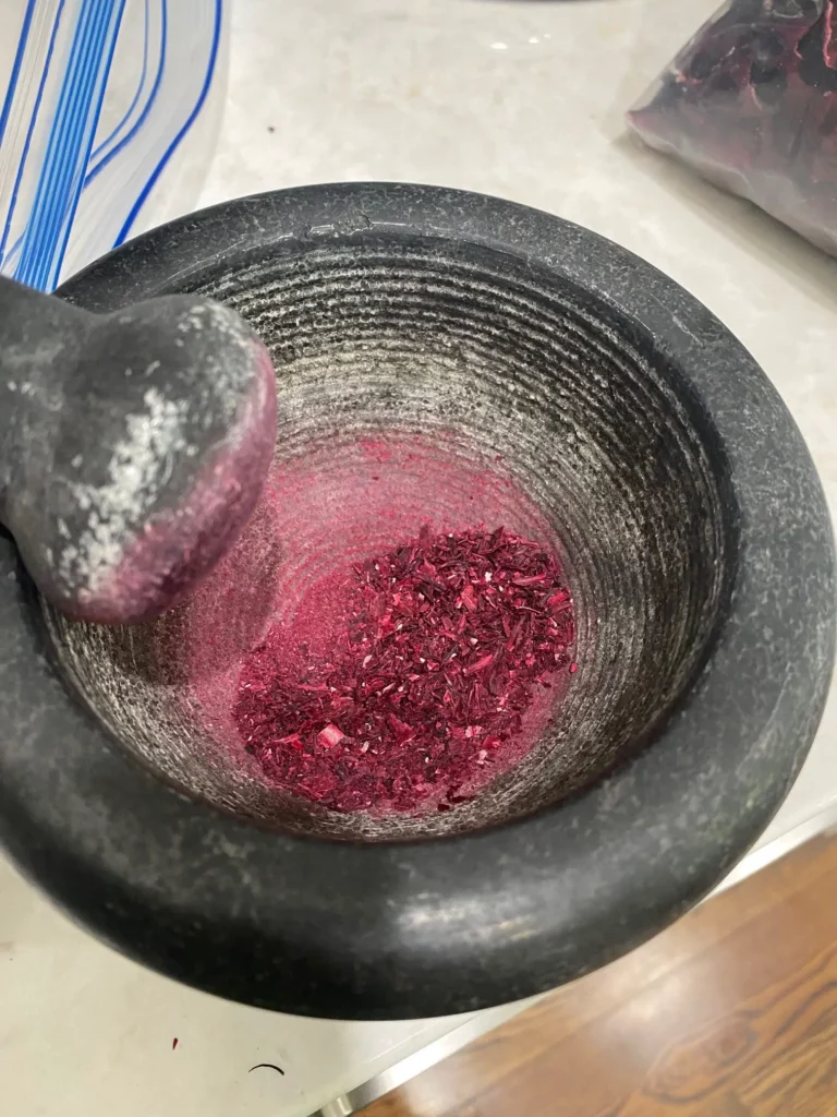 Hibiscus Powder in a mortar.