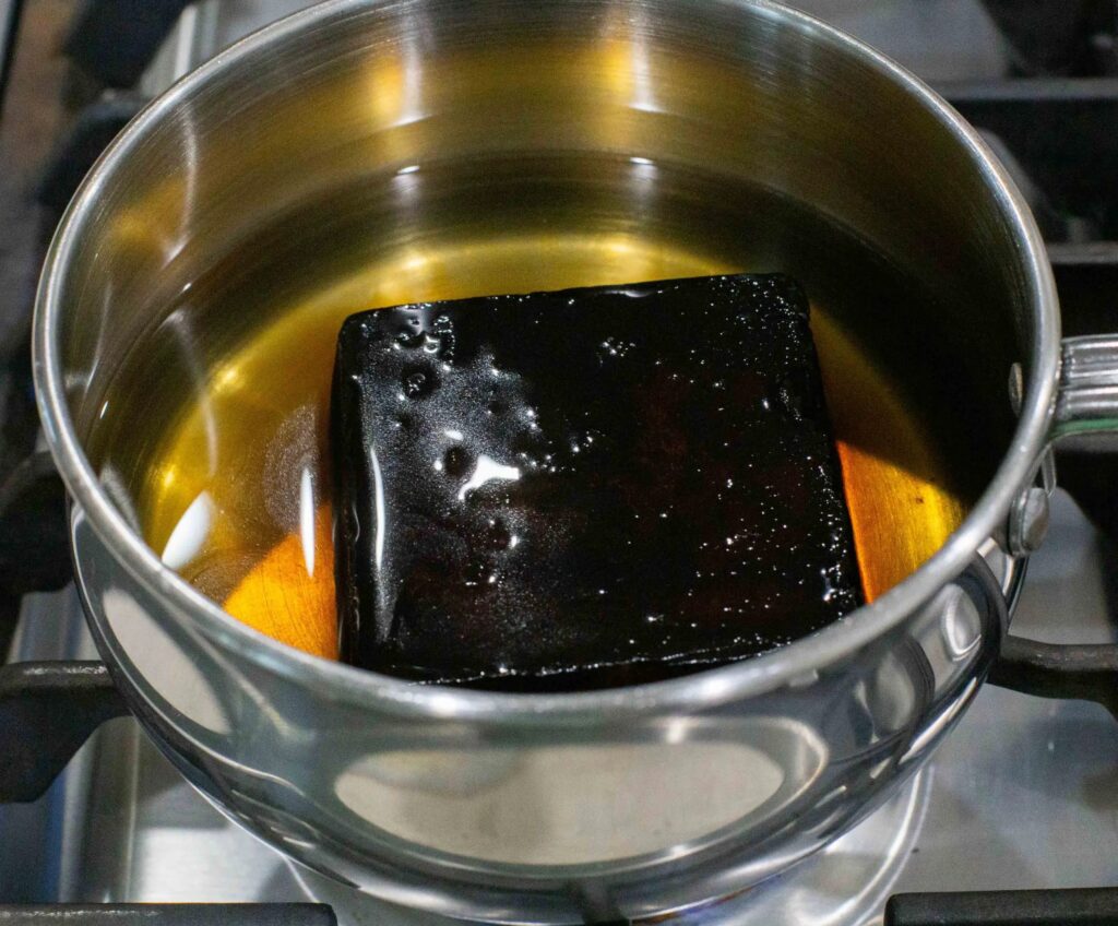 Pan de Chancaca inside a pot with water.