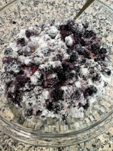 Mixed blackberries and sugar.