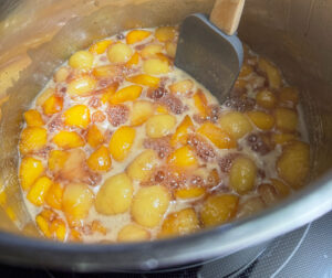 Boiling peach jam.